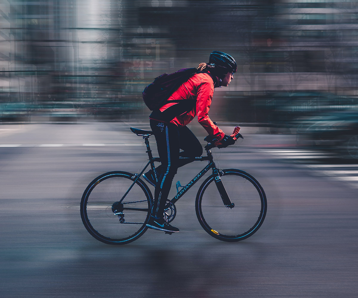 man with bicycle with face-mask