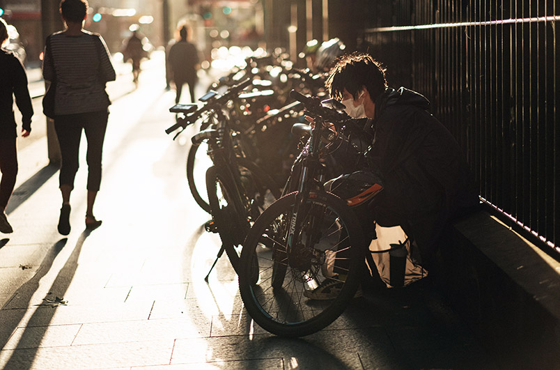 man with bicycle with face-mask